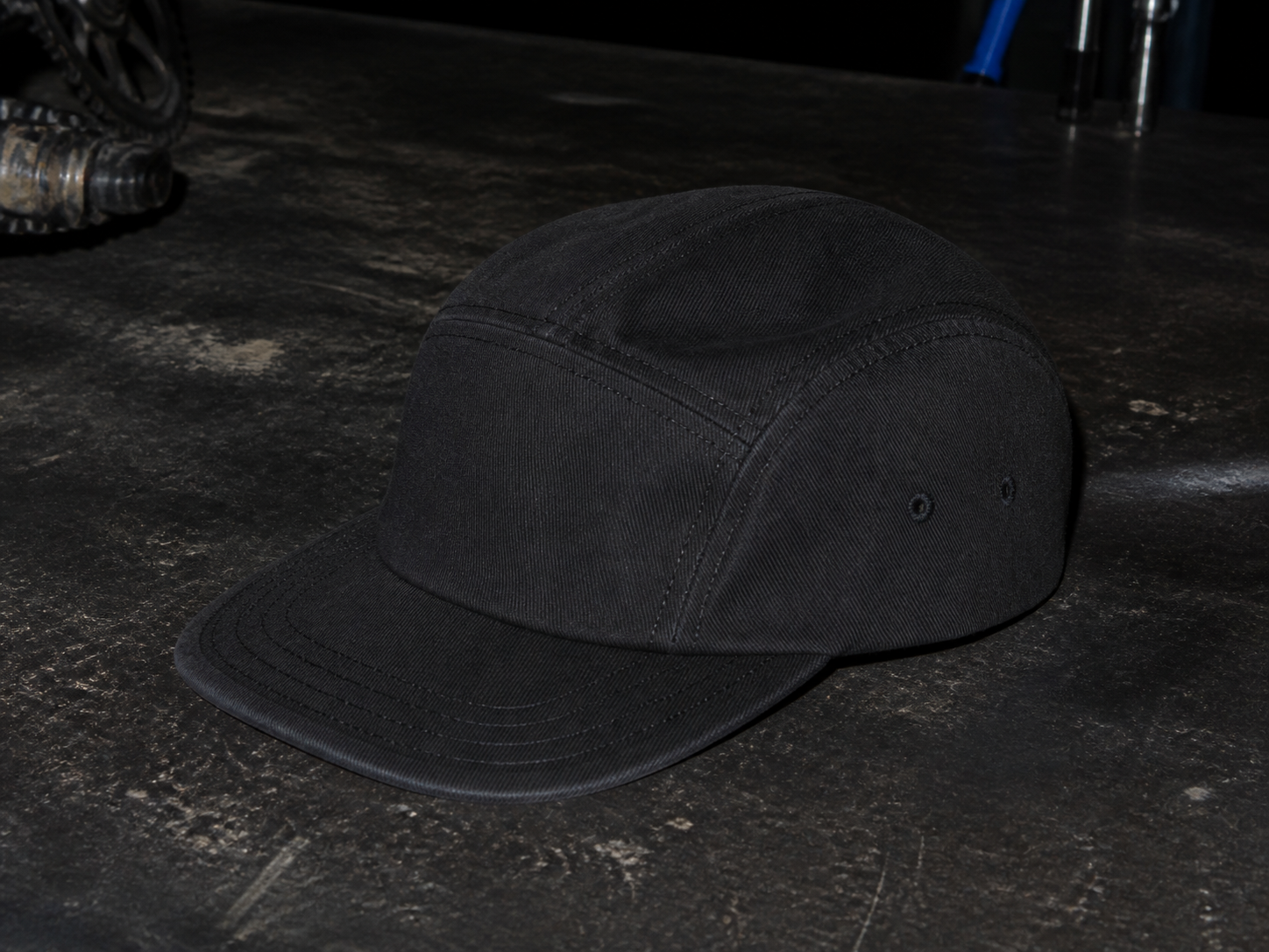 Black Workshop Cap on a workbench
